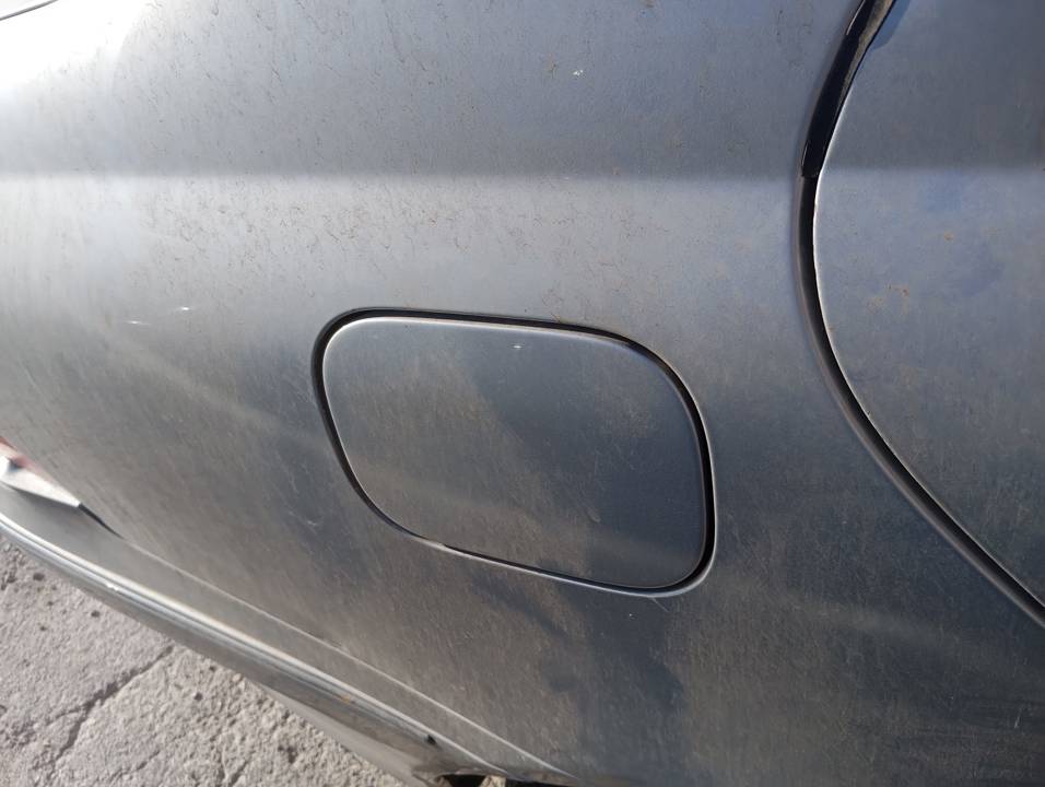 TAPA EXTERIOR COMBUSTIBLE