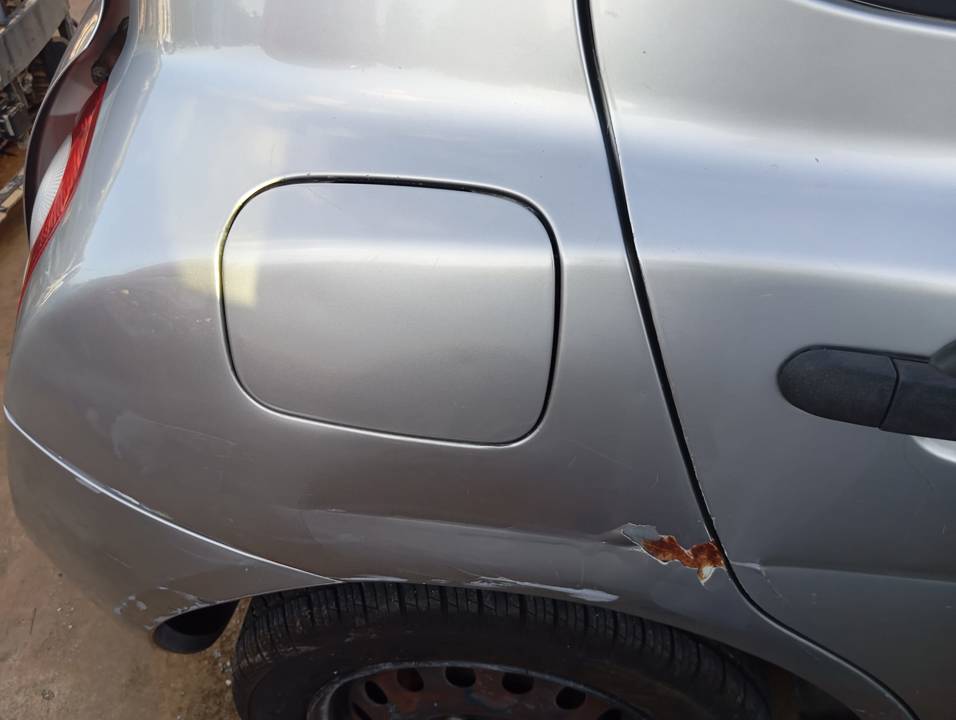 TAPA EXTERIOR COMBUSTIBLE