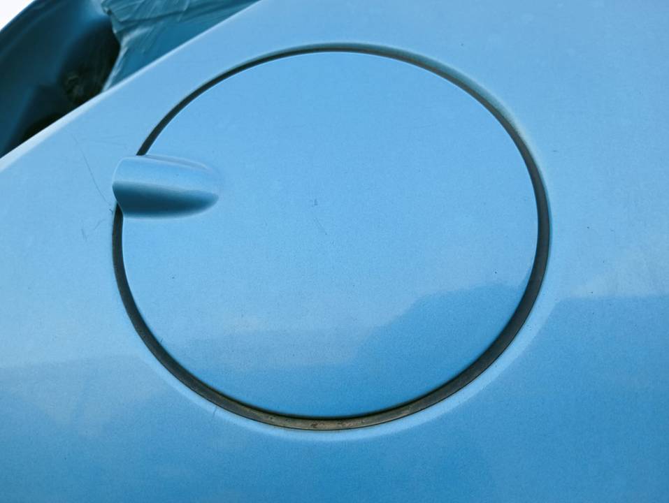 TAPA EXTERIOR COMBUSTIBLE