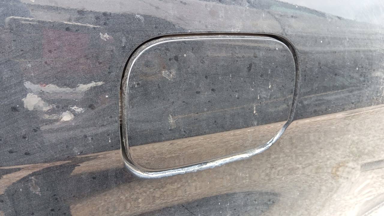 TAPA EXTERIOR COMBUSTIBLE