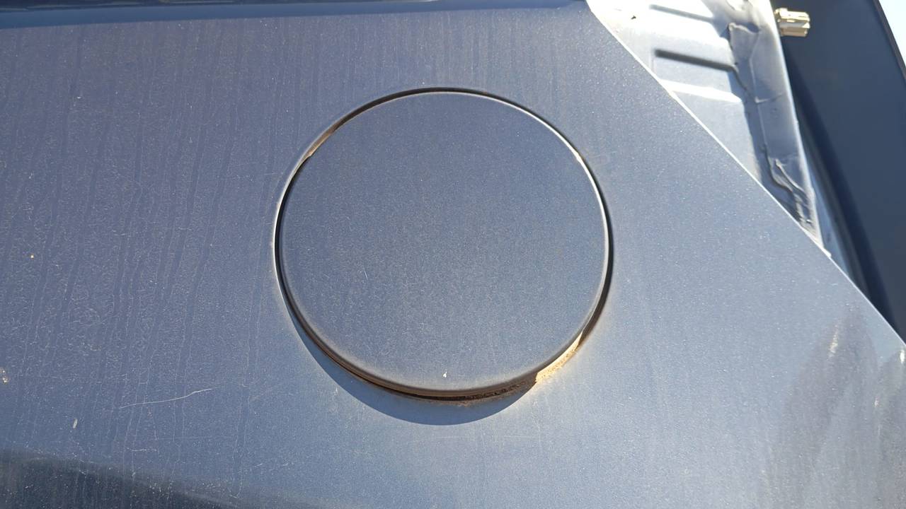 TAPA EXTERIOR COMBUSTIBLE