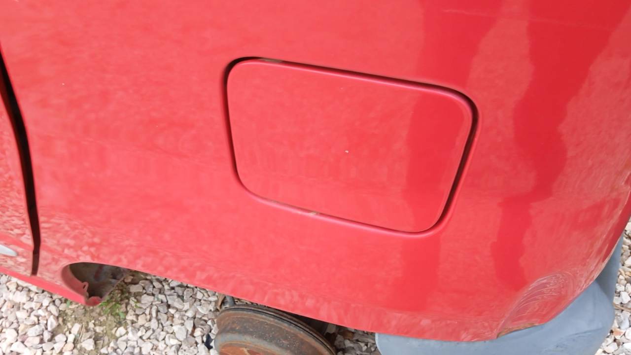 TAPA EXTERIOR COMBUSTIBLE