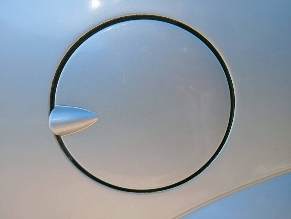 TAPA EXTERIOR COMBUSTIBLE