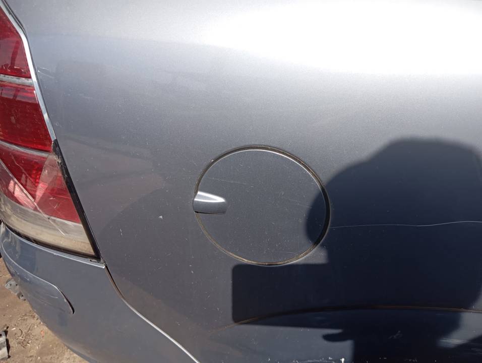 TAPA EXTERIOR COMBUSTIBLE