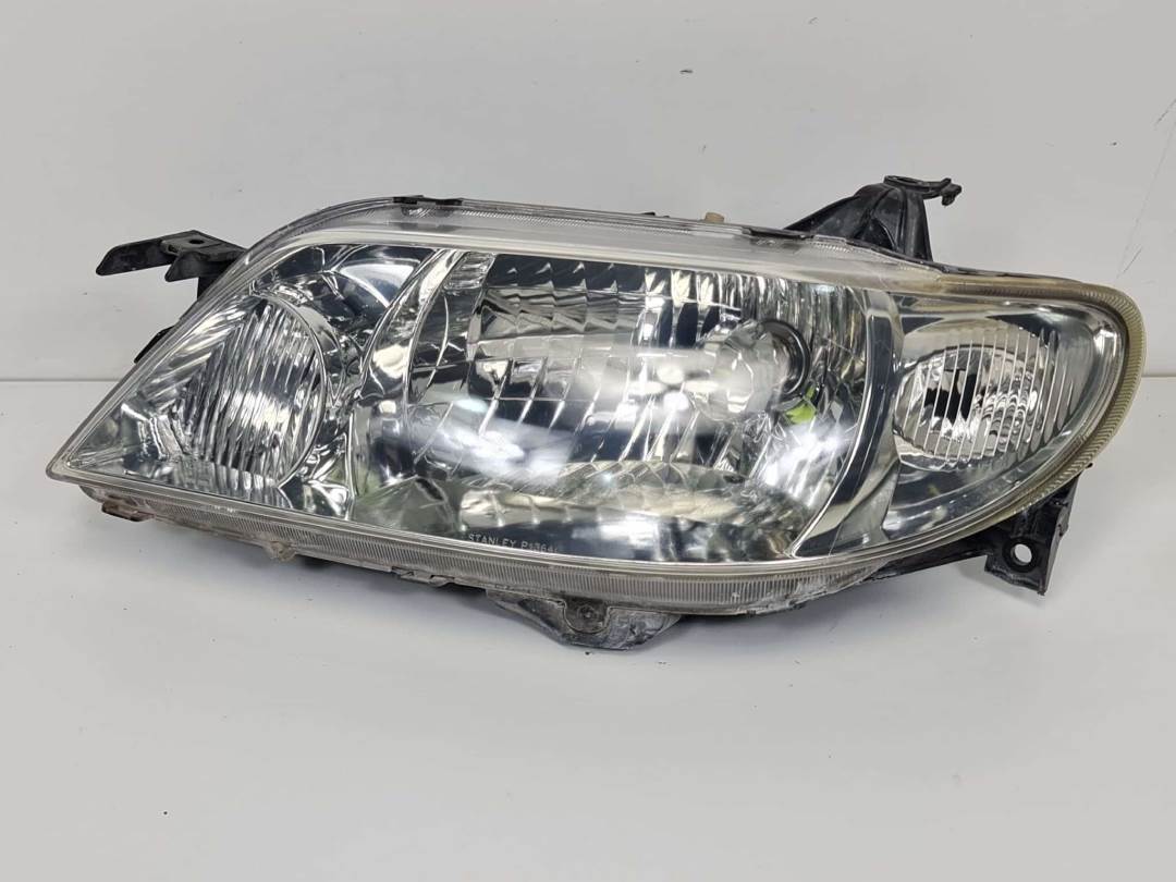 FARO IZQUIERDO - MAZDA - 323 BERL. F/S (BJ)