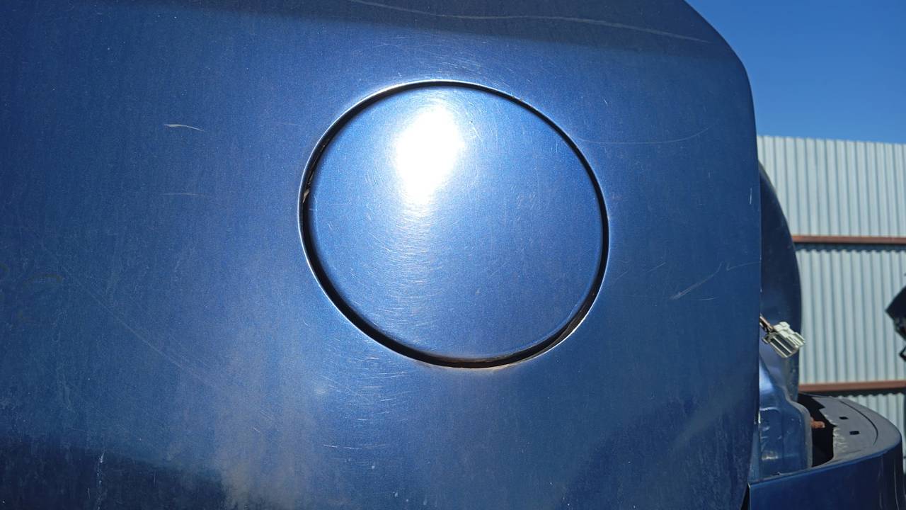 TAPA EXTERIOR COMBUSTIBLE