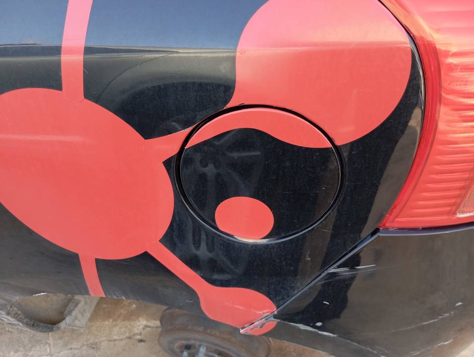 TAPA EXTERIOR COMBUSTIBLE
