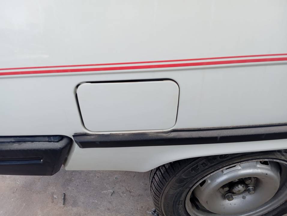 TAPA EXTERIOR COMBUSTIBLE