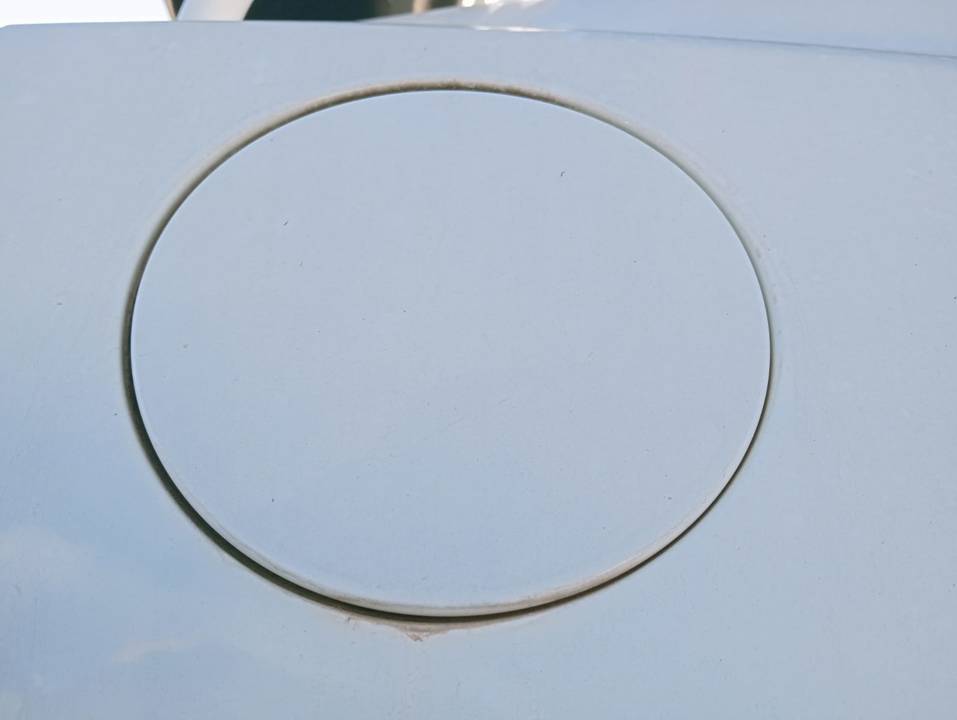 TAPA EXTERIOR COMBUSTIBLE