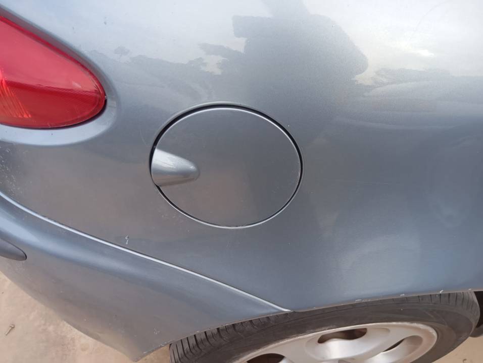 TAPA EXTERIOR COMBUSTIBLE