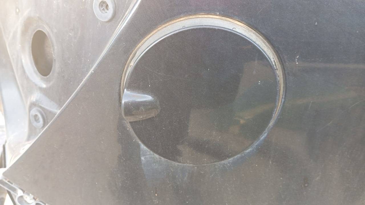 TAPA EXTERIOR COMBUSTIBLE