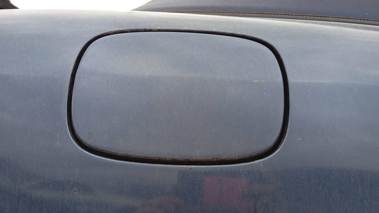 TAPA EXTERIOR COMBUSTIBLE