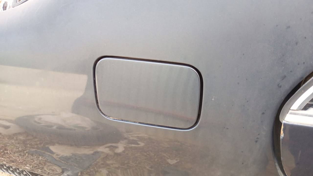 TAPA EXTERIOR COMBUSTIBLE