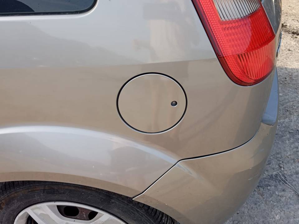 TAPA EXTERIOR COMBUSTIBLE