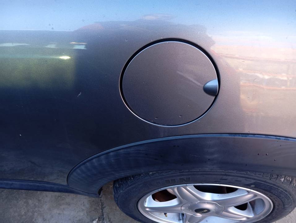 TAPA EXTERIOR COMBUSTIBLE