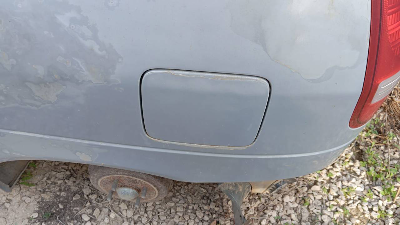 TAPA EXTERIOR COMBUSTIBLE