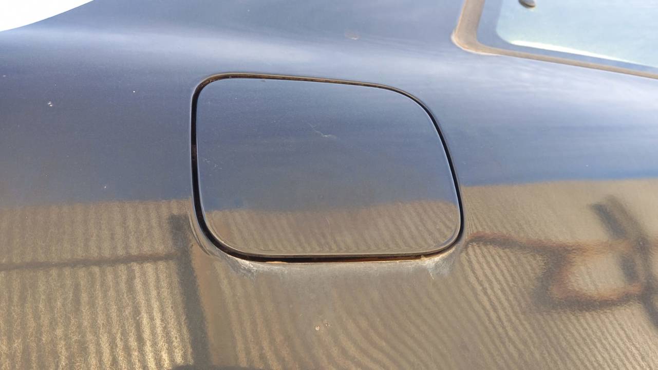 TAPA EXTERIOR COMBUSTIBLE