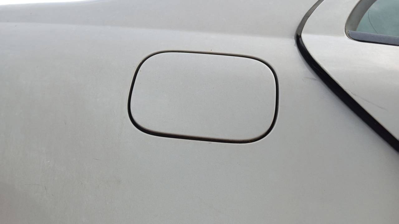 TAPA EXTERIOR COMBUSTIBLE
