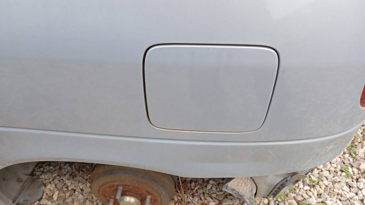 TAPA EXTERIOR COMBUSTIBLE