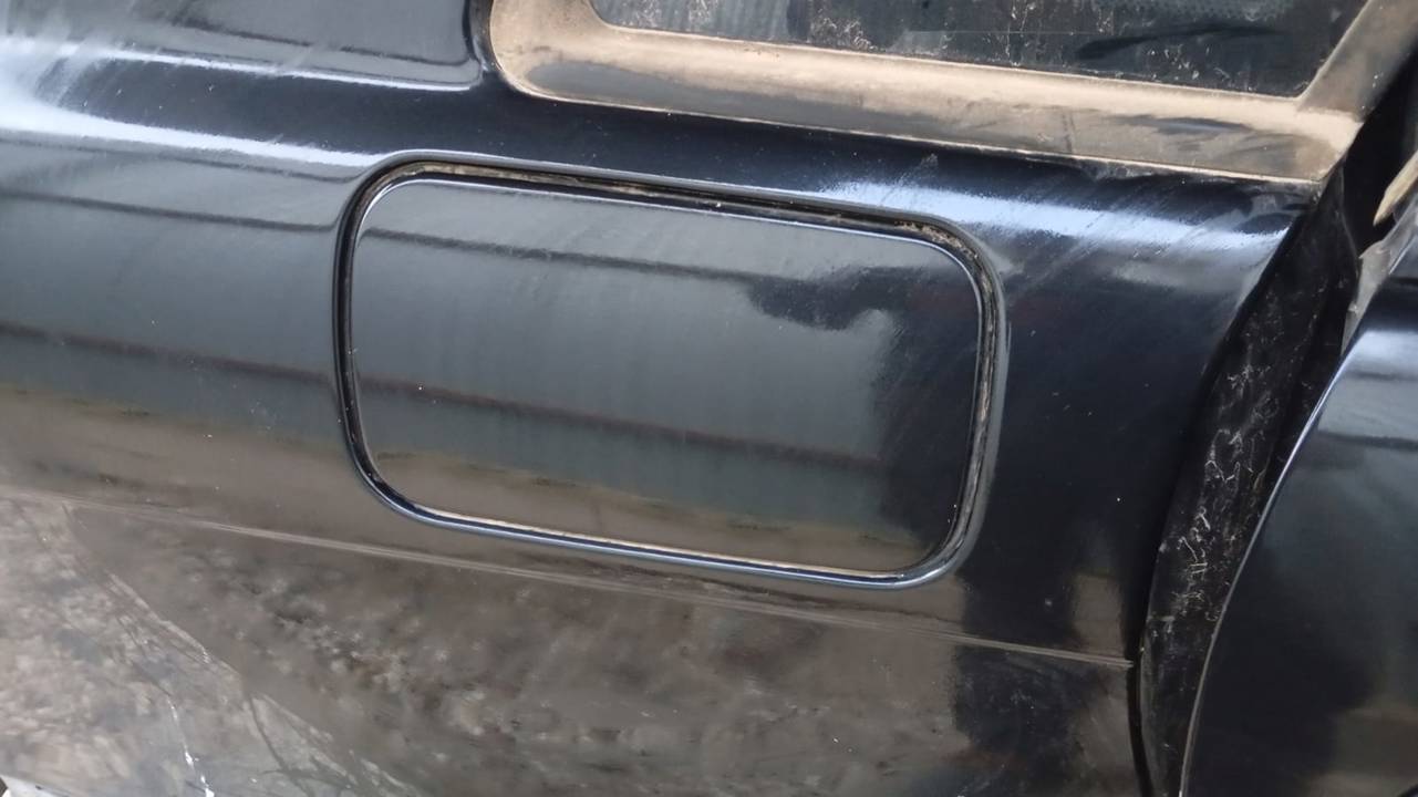 TAPA EXTERIOR COMBUSTIBLE