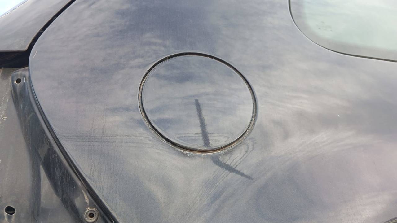 TAPA EXTERIOR COMBUSTIBLE