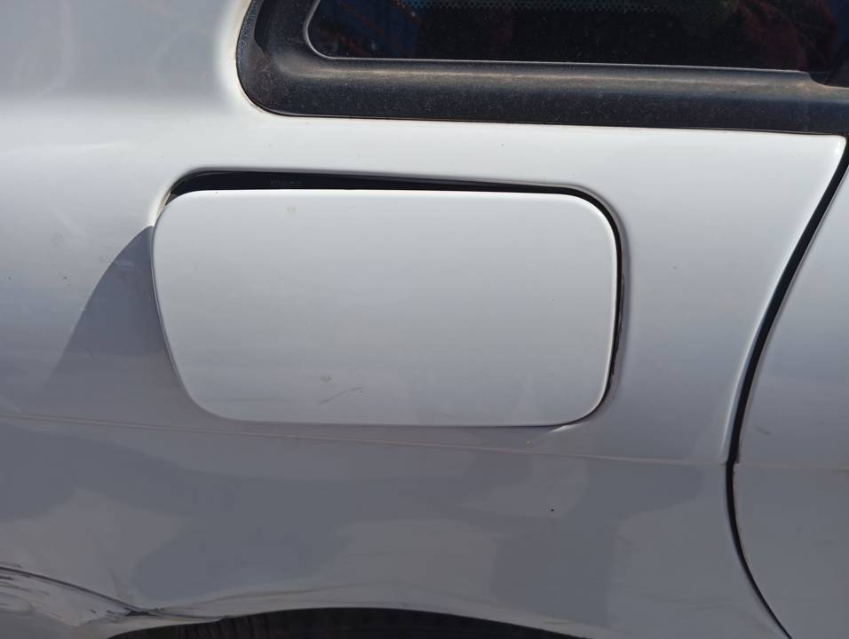 TAPA EXTERIOR COMBUSTIBLE