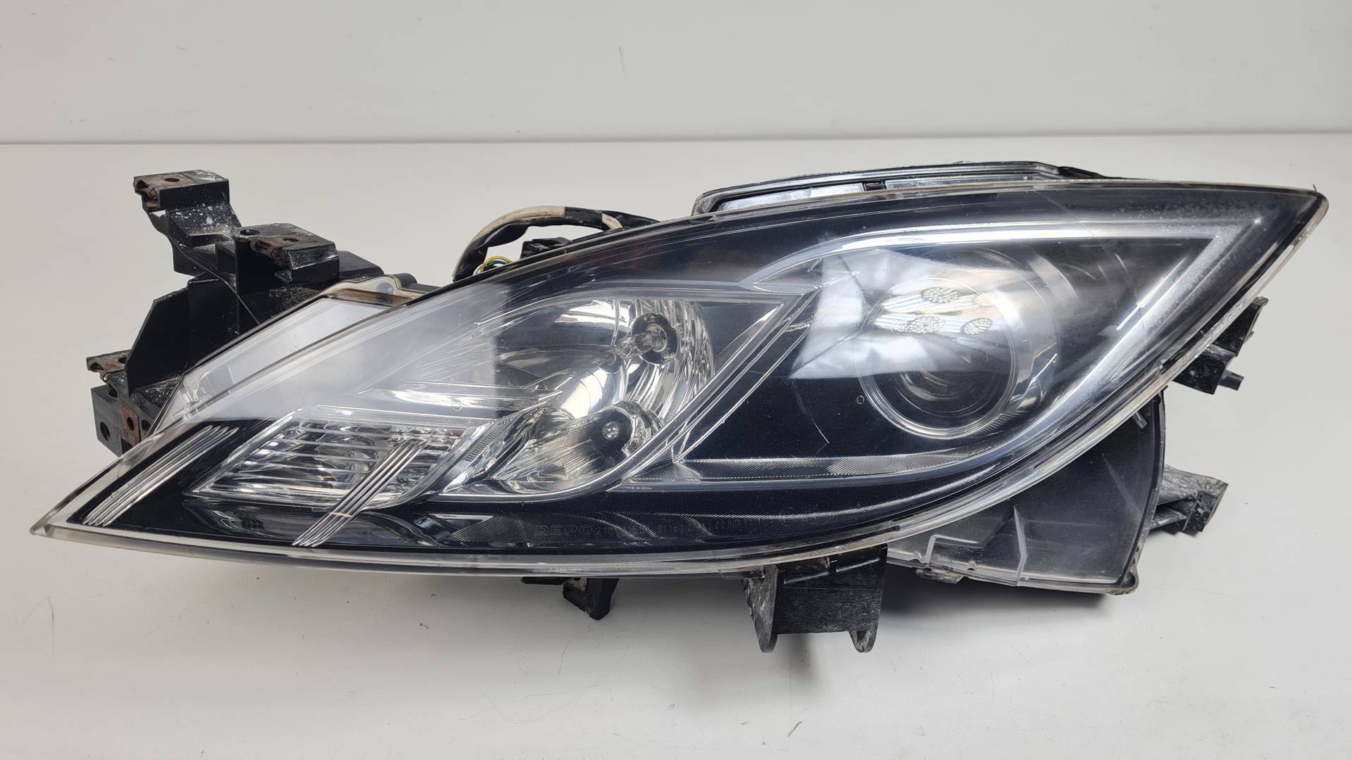 FARO IZQUIERDO - 082161155L - MAZDA - 6 LIM. (GH)